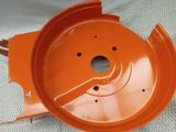 a close up of an orange plastic bowl on a white surface