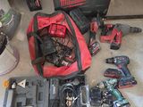 many tools that are sitting on the floor in the garage