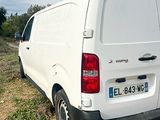 a white van that is parked on the side of the road