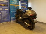 a motor scooter parked in a showroom