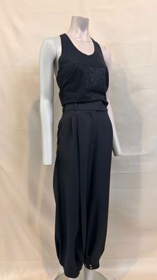 the mannequin is wearing a black top and black pants