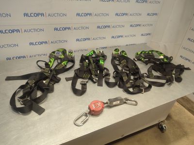 five motorbikes lined up on a table with a keychain