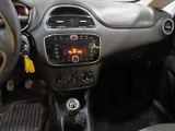 a dashboard of a car with a digital clock on it