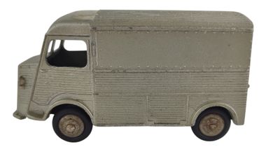 un camion jouet posé sur une surface blanche
