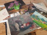 many cards on a table with a vase of flowers on it