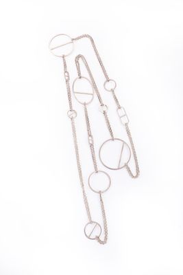 a close up of a pair of earrings on a white surface