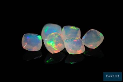 a group of white oplites on a black background