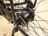 a close up of a bicycle wheel with a chain attached to it