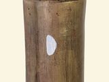 a gold vase with a white heart on it