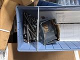 a box of screws and a box of screws on the floor