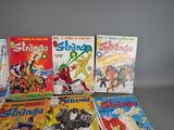 a lot of comic books on the table
