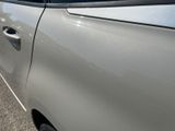 a close up of a car door handle with a sticker on it