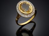 a yellow sapphire and diamond ring