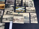 several old black and white photographs of people and animals on a table