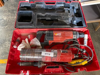 a red tool box with tools in it on the floor