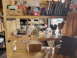 a wooden shelf that has various items on it