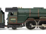 a toy train that is sitting on a white surface