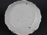 a white plate with a blue and white design on it
