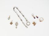 an assortment of jewellery including a necklace, ring, and earring