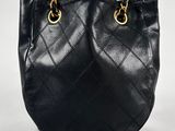 a chanel black quilted leather shoulder bag with gold hardware