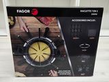 the box is open to show the contents of a kitchen gadgetr