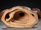 a clay sculpture of a bird ' s nest on a table