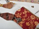 a red purse with a red and gold design on it