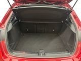 a trunk of a red car with its trunk open