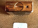a close up picture of a lighter on a leather surface