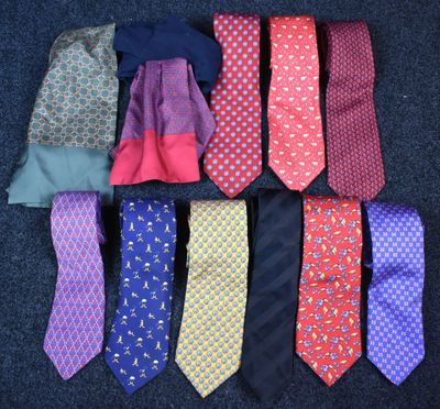 several different colored ties laid out in a row on a blue carpet