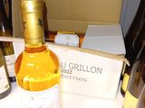 many bottles of wine sitting on a table next to a box