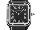 a close up of a wrist watch with roman numerals on the face