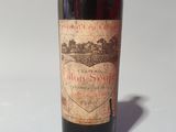 a bottle of wine that is sitting on a table