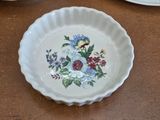 a plate with a flower design on it on a table