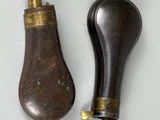 pair of antique brass and wood door knobs on a white surface
