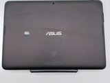 the back of a laptop with a small screen on a white surface