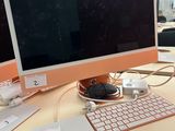 a computer on a desk with a keyboard and mouse