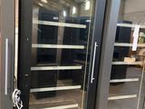 two double glass doors that are open in a store