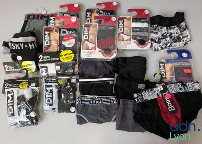a lot of men ' s underwear that are on the table