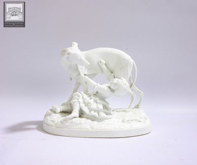 a figurine of a dog and a cat on a table