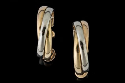 boucles d'oreilles créoles bicolores, or et argent, sur fond noir