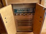 a small cabinet that is open to show the contents