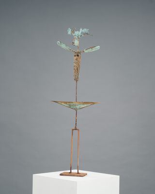 an image of a sculpture of a bird on top of a white pedestal