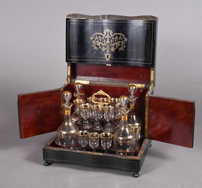 a silver plated tea set in a wooden case