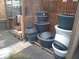 many black and white pots stacked on top of each other