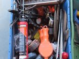 a blue box filled with assorted tools on a table