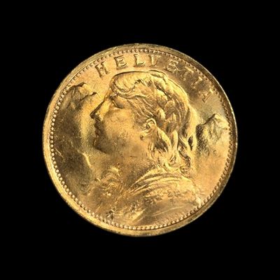 gros plan d'une pièce d'or portant un visage de femme