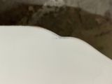 a close up of a toilet bowl with the lid down
