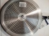 an image of a stainless steel frying pan with a lid