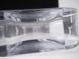 a clear glass container sitting on top of a white table